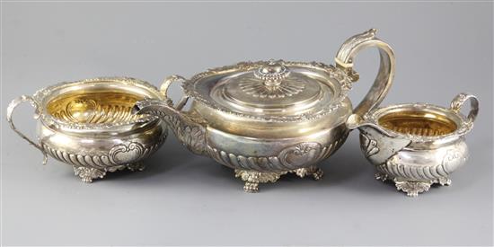 A George III demi fluted silver circular three piece tea set by Joseph Angell I, gross 47.5 oz.